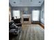 Inviting living room features a cozy fireplace, hardwood floors, and comfortable seating, perfect for relaxation at 2669 Ambria Dr, Buford, GA 30519