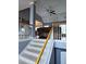 Interior shot of staircase with wooden handrail, neutral carpeting, and gray walls at 2669 Ambria Dr, Buford, GA 30519