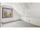 Bright attic space with carpet flooring, large windows, and white walls at 28 Exeter Rd, Avondale Estates, GA 30002
