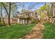 Backyard featuring a grassy lawn and a deck, perfect for outdoor activities and relaxation at 28 Exeter Rd, Avondale Estates, GA 30002