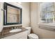 Bathroom features granite countertop, mirror, and natural light from the window at 28 Exeter Rd, Avondale Estates, GA 30002