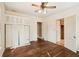 Spacious bedroom with hardwood floors and multiple doorways at 28 Exeter Rd, Avondale Estates, GA 30002