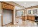 Open-concept kitchen with wood cabinets, tile flooring, and a breakfast bar island at 28 Exeter Rd, Avondale Estates, GA 30002