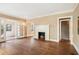 Spacious living room with hardwood floors and a traditional fireplace creating a warm, inviting atmosphere at 28 Exeter Rd, Avondale Estates, GA 30002
