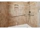 Tiled walk-in shower with grab bars and convenient recessed shelving at 28 Exeter Rd, Avondale Estates, GA 30002