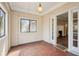 Bright sunroom featuring tile flooring and a view into the living room at 28 Exeter Rd, Avondale Estates, GA 30002