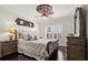 Elegant bedroom features a ceiling fan and detailed moldings at 2875 Waterstone Dr, Cumming, GA 30041