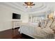 Relaxing bedroom setting featuring a TV, large windows, and refined decor for modern living at 2875 Waterstone Dr, Cumming, GA 30041
