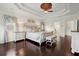 Bright primary bedroom showcases elegant finishes, hardwood floors, and ample natural light at 2875 Waterstone Dr, Cumming, GA 30041