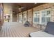 Covered back deck featuring ceiling fans, outdoor lounge, and views of the backyard at 2875 Waterstone Dr, Cumming, GA 30041