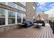 Relaxing deck area featuring ample seating with views of the home's exterior brickwork at 2875 Waterstone Dr, Cumming, GA 30041