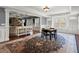 Large game room featuring coffered ceilings, hardwood floors, and a stylish area rug at 2875 Waterstone Dr, Cumming, GA 30041