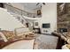 Living room boasts soaring ceilings and a stone fireplace, creating an inviting ambiance at 2875 Waterstone Dr, Cumming, GA 30041