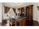 This home office features custom wood cabinetry, a large desk and plenty of natural light at 2875 Waterstone Dr, Cumming, GA 30041