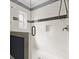 Modern shower design with white tile, a mosaic accent stripe, glass enclosure, and built-in niche for toiletries at 2875 Waterstone Dr, Cumming, GA 30041