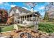 Charming backyard with a fire pit, Adirondack chairs, and a well-manicured lawn, perfect for relaxation at 3509 Ivy Manor Se Rd, Smyrna, GA 30080