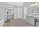 Bright and airy bathroom with double vanities, tub, and separate toilet room at 3509 Ivy Manor Se Rd, Smyrna, GA 30080