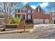 Stately brick home with manicured front yard, featuring a welcoming entrance and two-car garage at 3509 Ivy Manor Se Rd, Smyrna, GA 30080