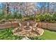 Cozy backyard firepit area with Adirondack chairs, perfect for outdoor gatherings at 3509 Ivy Manor Se Rd, Smyrna, GA 30080