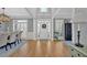 Bright foyer with wood floors and a view of the front door, dining area and living spaces at 3509 Ivy Manor Se Rd, Smyrna, GA 30080