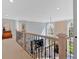 Beautiful foyer overlooking living room, with wrought iron railing and large windows providing plenty of natural light at 3509 Ivy Manor Se Rd, Smyrna, GA 30080