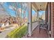 Charming front porch with brick flooring, white railings, and outdoor seating, perfect for relaxing at 3509 Ivy Manor Se Rd, Smyrna, GA 30080