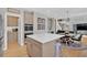 Open concept kitchen features modern cabinets, stainless appliances, and a kitchen island with seating at 3509 Ivy Manor Se Rd, Smyrna, GA 30080