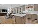 Open concept kitchen with modern cabinets, stainless appliances, kitchen island, and breakfast nook at 3509 Ivy Manor Se Rd, Smyrna, GA 30080