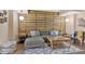 Cozy living room featuring wood accent wall and comfortable sectional sofa at 3509 Ivy Manor Se Rd, Smyrna, GA 30080