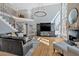 Spacious living room with hardwood floors, two-story windows, fireplace, and staircase to the second floor at 3509 Ivy Manor Se Rd, Smyrna, GA 30080
