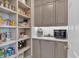 Walk-in pantry offers custom shelving, ample storage, and easy access to kitchen essentials at 3509 Ivy Manor Se Rd, Smyrna, GA 30080