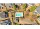 Aerial shot of a community pool and parking lot surrounded by residential properties and well-manicured landscaping at 3509 Ivy Manor Se Rd, Smyrna, GA 30080