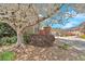 Charming brick entrance with flowering tree and manicured bushes along the street at 3509 Ivy Manor Se Rd, Smyrna, GA 30080