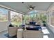 Inviting sunroom with plenty of sunlight, comfortable seating, and serene backyard views at 3509 Ivy Manor Se Rd, Smyrna, GA 30080