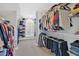 Spacious walk-in closet with ample storage space and organized racks, perfect for a large wardrobe at 3509 Ivy Manor Se Rd, Smyrna, GA 30080