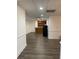 Spacious basement with dark wood floors, a convenient wet bar, and a mini fridge, perfect for entertaining guests at 4748 Arcado Sw Rd, Lilburn, GA 30047