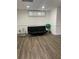 Finished basement featuring modern flooring, a futon, and natural light at 4748 Arcado Sw Rd, Lilburn, GA 30047