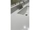 Close-up of a white bathroom sink with granite countertops and a modern faucet at 4748 Arcado Sw Rd, Lilburn, GA 30047