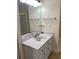 Bathroom featuring a granite countertop, a modern sink, and white cabinets at 4748 Arcado Sw Rd, Lilburn, GA 30047