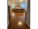 Spacious bedroom features hardwood floors, a tray ceiling, and large windows at 4748 Arcado Sw Rd, Lilburn, GA 30047