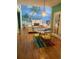 Bright dining area with views of the lush mural and adjacent living spaces at 4748 Arcado Sw Rd, Lilburn, GA 30047