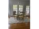 Dining area with a glass table and decorative chairs at 4748 Arcado Sw Rd, Lilburn, GA 30047