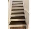Painted wood stairs leading to an upper level at 4748 Arcado Sw Rd, Lilburn, GA 30047