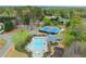 A serene community pool, tennis courts, and recreation area nestled among lush trees at 1060 Meadow Brook Dr, Woodstock, GA 30188