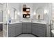 Bathroom with double vanity, with modern gray cabinets, mirrors, lighting and tiled floor and wall accessories at 1060 Meadow Brook Dr, Woodstock, GA 30188