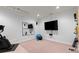 Home exercise room featuring workout equipment, mirrors, and a TV for an invigorating workout session at 1060 Meadow Brook Dr, Woodstock, GA 30188