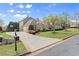 Beautiful home featuring well-manicured landscaping and a spacious driveway at 1060 Meadow Brook Dr, Woodstock, GA 30188