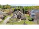 Beautifully landscaped home with a well-maintained lawn and mature trees at 1060 Meadow Brook Dr, Woodstock, GA 30188