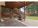 Outdoor patio with stone flooring, wood burning, staircase, and space to grill at 1060 Meadow Brook Dr, Woodstock, GA 30188