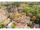 Aerial view of the property surrounded by lush trees and neighboring homes at 1714 Highland Pl, Decatur, GA 30035